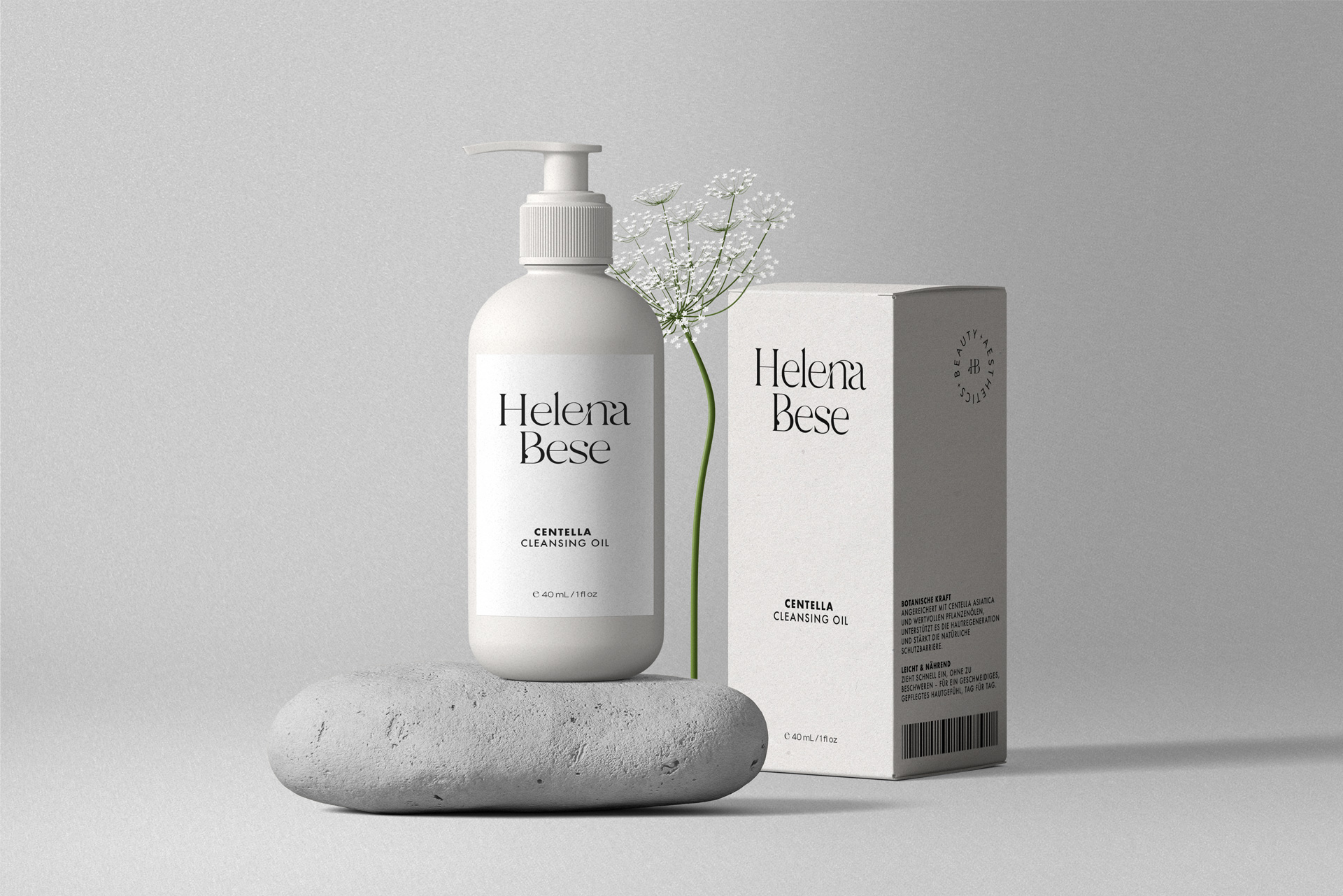 cosmetic-bottle-with-pump-and-paper-box-mockups-on-stone-front-view